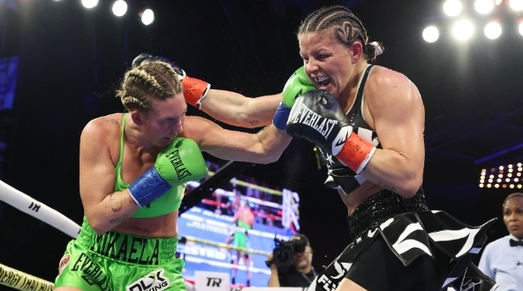 Mikaela Mayer is once again a world champion after beating bitter rival Sandy Ryan